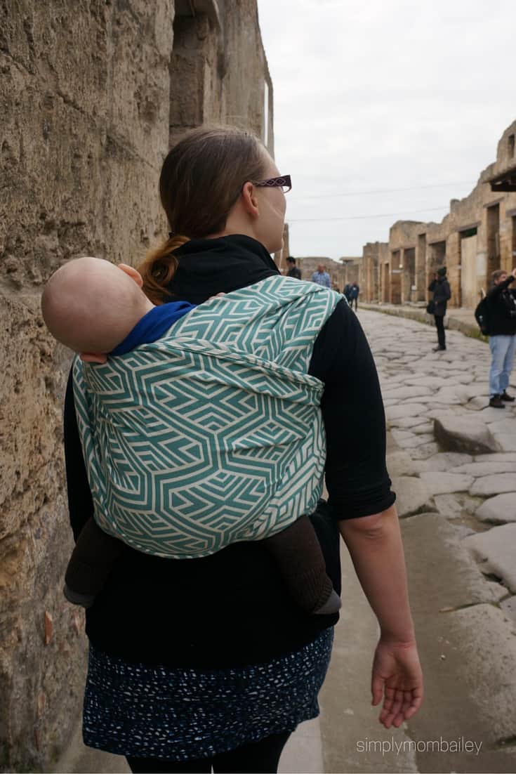 woman wearing baby in a woven wings double hammock in Pompeii Italy