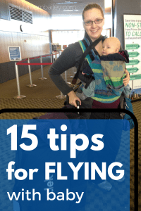15 tips for flying with a baby, a mom wearing her baby in the airport