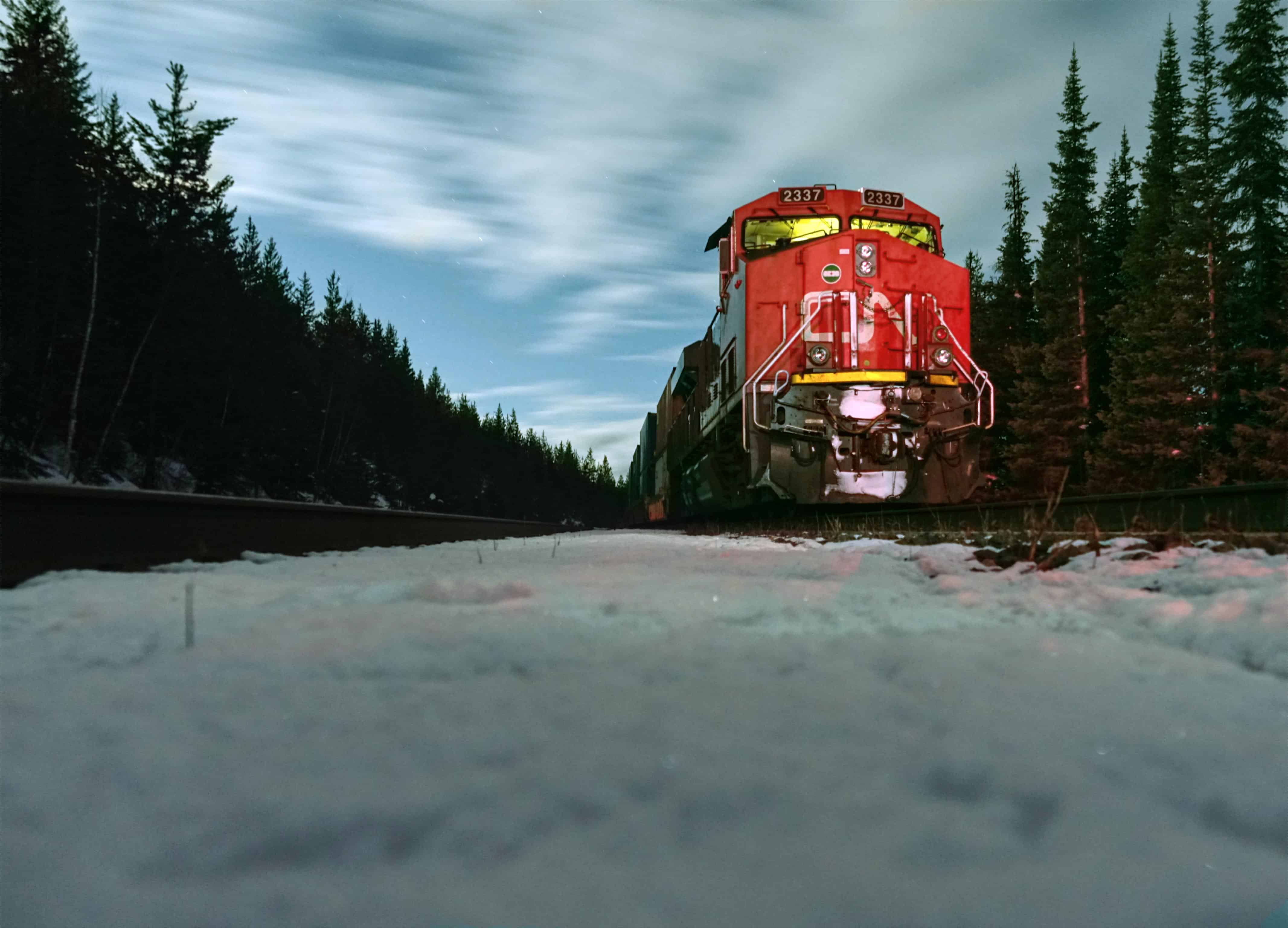 CN Rail Train at Night along snow. 