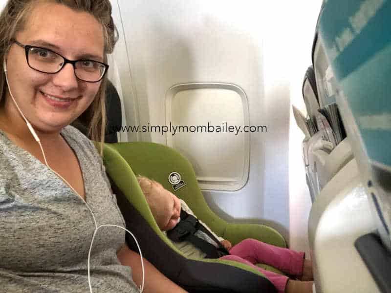 Flying with Carseats - It's easy picture of mom and baby on an airplane in a carseat