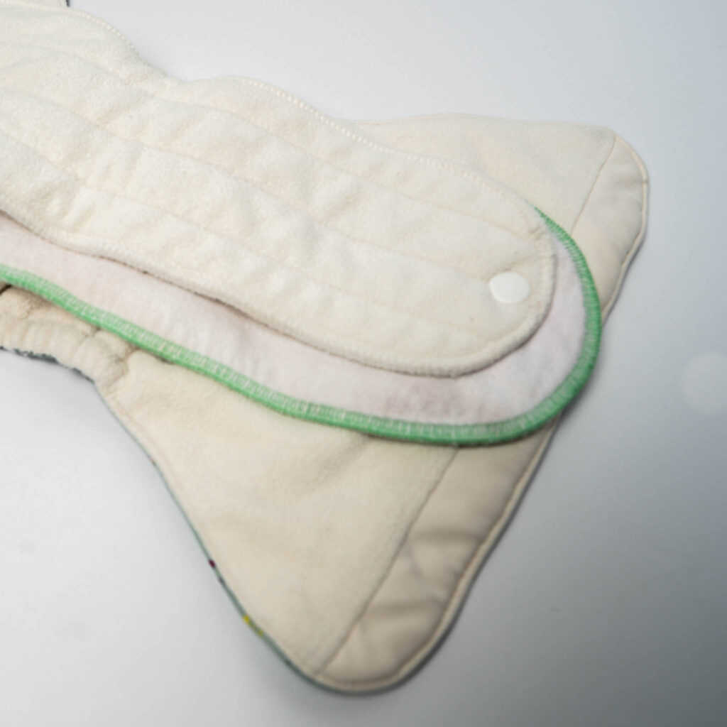 Image of the inside of the GroVia ONE Diaper with GeffenBaby Insert and then the large GroVia Insert on top.